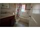 Bathroom with tiled walls and shower/tub combo at 1357 Sharon St, Atlanta, GA 30314