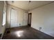Simple bedroom with carpet, two doors, and a window at 1357 Sharon St, Atlanta, GA 30314