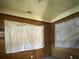 Spacious bedroom with wood paneling and neutral walls at 1357 Sharon St, Atlanta, GA 30314