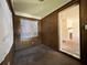 Bright bedroom with wood paneling and view to living room at 1357 Sharon St, Atlanta, GA 30314