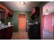Kitchen with stainless steel appliances and orange walls at 1357 Sharon St, Atlanta, GA 30314