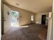 Bright living room with entryway and carpet at 1357 Sharon St, Atlanta, GA 30314