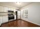 Bright kitchen with stainless steel appliances and view to living area at 3742 Jamestown Ct, Atlanta, GA 30340