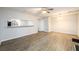 Open concept living room and dining area with wood-look floors and a ceiling fan at 3742 Jamestown Ct, Atlanta, GA 30340