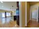 Hardwood floor hallway connecting to kitchen and other rooms at 5705 Upper Creek Ct, Suwanee, GA 30024