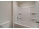 Clean bathroom featuring a bathtub, shower, and built-in shelving at 591 River Gardens Se Dr, Atlanta, GA 30354