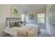 Bright bedroom with a plush bed, large windows, and tasteful artwork at 591 River Gardens Se Dr, Atlanta, GA 30354