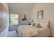 Well-lit bedroom with a queen bed, window, and neutral decor at 591 River Gardens Se Dr, Atlanta, GA 30354