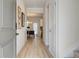 Light and bright entryway with hardwood floors, leading to the living and dining areas at 591 River Gardens Se Dr, Atlanta, GA 30354