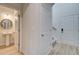 View of a second entry with powder room and stairs leading upstairs at 591 River Gardens Se Dr, Atlanta, GA 30354