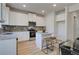 Modern kitchen with white cabinets, granite countertops, and an island at 591 River Gardens Se Dr, Atlanta, GA 30354