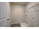 Simple laundry room with shelving and drain at 591 River Gardens Se Dr, Atlanta, GA 30354