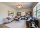 Spacious living room features a neutral color palette, plush seating, and stylish shelving at 591 River Gardens Se Dr, Atlanta, GA 30354