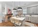 Updated kitchen with gray cabinets, white quartz countertops, and an island at 771 Tift Sw Ave, Atlanta, GA 30310