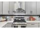 Modern kitchen features stainless steel appliances and white shaker cabinets at 771 Tift Sw Ave, Atlanta, GA 30310