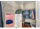 Large closet with shelving and a hidden room with beanbag chair at 2714 Vinings Oak Se Dr, Atlanta, GA 30339