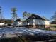 Back of house with sunroom and garden area at 1601 Rockdale Cir, Snellville, GA 30078