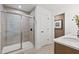 Modern bathroom with walk-in shower and tile flooring at 1617 Tide Mill Rd, Cumming, GA 30040