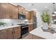 Modern kitchen with stainless steel appliances and light wood cabinets at 1617 Tide Mill Rd, Cumming, GA 30040