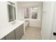 Bathroom with gray vanity, white quartz countertop and a soaking tub at 500 Chimney House Ct, Stone Mountain, GA 30087