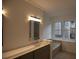 Bathroom with gray vanity, quartz countertop and a soaking tub at 500 Chimney House Ct, Stone Mountain, GA 30087