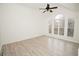 Spacious bedroom with hardwood floors and large window at 500 Chimney House Ct, Stone Mountain, GA 30087