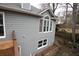 Gray house exterior with large windows and backyard at 500 Chimney House Ct, Stone Mountain, GA 30087