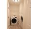 Convenient laundry room with washer and dryer at 500 Chimney House Ct, Stone Mountain, GA 30087