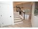 Elegant staircase with white risers and black spindles at 500 Chimney House Ct, Stone Mountain, GA 30087