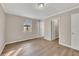 Bright bedroom with large window and wood-look flooring at 80 Yvette Ne Ct, Kennesaw, GA 30144