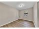 Simple bedroom with wood-look flooring and neutral walls at 80 Yvette Ne Ct, Kennesaw, GA 30144