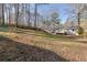 Backyard view of a ranch home with a deck at 80 Yvette Ne Ct, Kennesaw, GA 30144