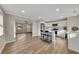 Open concept kitchen with white cabinets and island, looking toward living room at 80 Yvette Ne Ct, Kennesaw, GA 30144