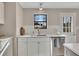 White kitchen with stainless steel appliances and subway tile backsplash at 80 Yvette Ne Ct, Kennesaw, GA 30144