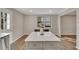 Kitchen island with white quartz countertop and light gray cabinets at 80 Yvette Ne Ct, Kennesaw, GA 30144