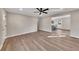 Open living room with hardwood floors, access to kitchen and entryway at 80 Yvette Ne Ct, Kennesaw, GA 30144