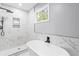 Elegant bathroom features a freestanding tub and marble shower at 819 Norwood Se Rd, Atlanta, GA 30315