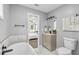 Modern bathroom with soaking tub, walk-in shower, and updated vanity at 819 Norwood Se Rd, Atlanta, GA 30315