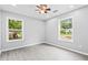 Spacious bedroom with gray walls, vinyl flooring, and ceiling fan at 819 Norwood Se Rd, Atlanta, GA 30315