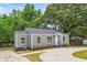 Newly renovated gray house with a landscaped yard and driveway at 819 Norwood Se Rd, Atlanta, GA 30315