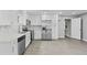 Modern kitchen with white cabinets and stainless steel appliances at 819 Norwood Se Rd, Atlanta, GA 30315