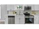 Modern kitchen with white cabinets and stainless steel appliances at 819 Norwood Se Rd, Atlanta, GA 30315