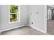 Bright laundry room with gray walls and vinyl flooring at 819 Norwood Se Rd, Atlanta, GA 30315