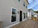 Exterior view of backyard deck with access to the house and surrounding yard at 120 Stonehouse Dr, Cumming, GA 30040