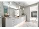 Modern bathroom featuring a double vanity, pendant lighting, and elegant marble floors for a luxurious feel at 902 Lenox Ne Blvd, Atlanta, GA 30324