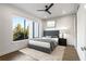 Modern bedroom with large window, ceiling fan, and stylish decor at 902 Lenox Ne Blvd, Atlanta, GA 30324