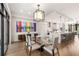 A modern dining room with a glass table is adjacent to a gourmet kitchen and has access to the balcony at 902 Lenox Ne Blvd, Atlanta, GA 30324