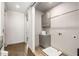 Functional laundry room with wooden floors, gray cabinetry, and sleek design at 902 Lenox Ne Blvd, Atlanta, GA 30324