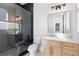 Modern bathroom with natural light, a frameless shower, and a floating vanity at 2297 Lake Ridge Ter, Lawrenceville, GA 30043