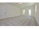 Spacious bonus room with carpet flooring and door to exterior at 3278 Greenhill Dr, Villa Rica, GA 30180